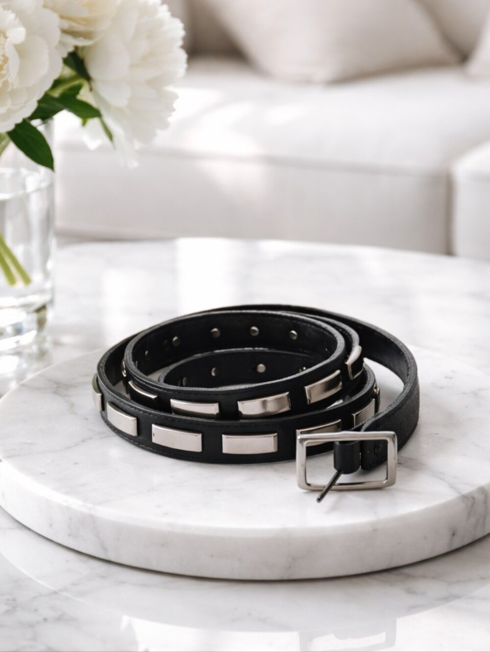 Danier Leather belt with studs.42" long. 1st hole at 34", last at 38". 1" wide